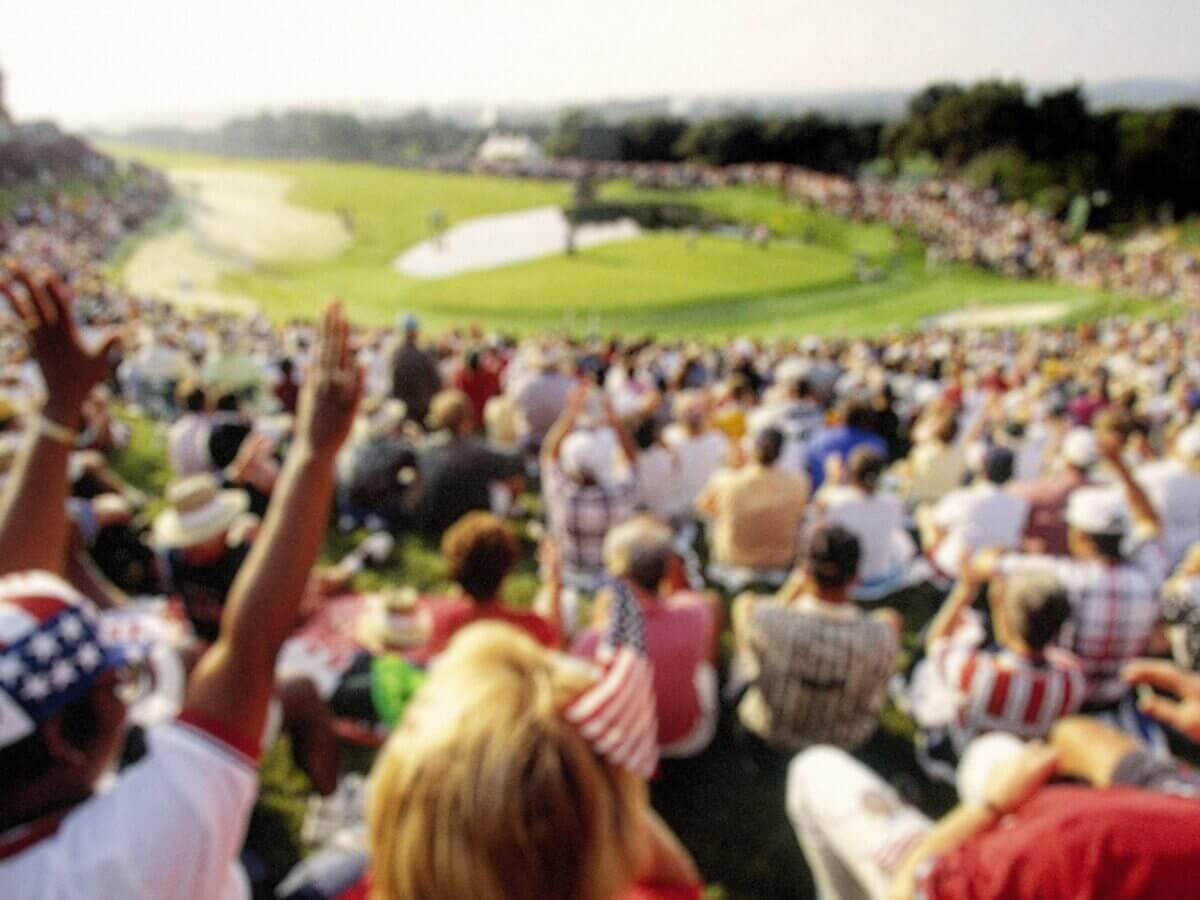 Fans cheering at a golf tournament