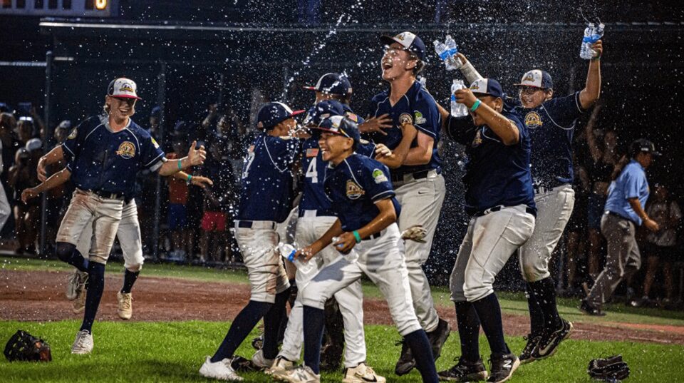 a youth baseball team celebrates the win