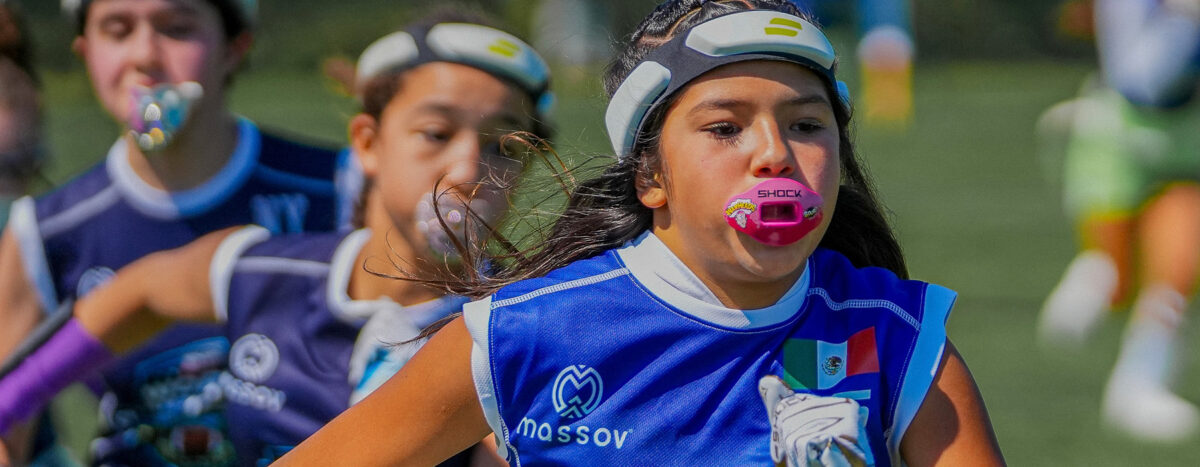 A girls' flag football team making a play