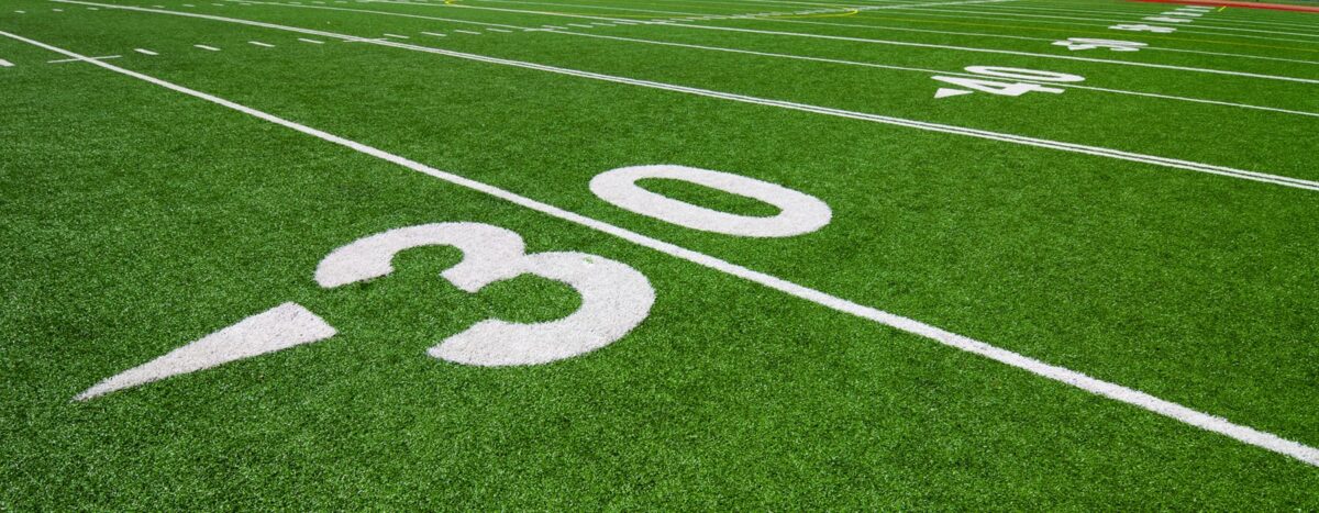 An American football field showing the 30 yard line marker
